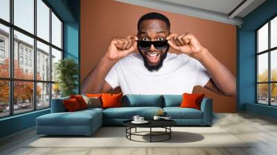 Close-up portrait of his he nice attractive cool cheerful cheery glad amazed bearded guy wearing white tshirt touching specs wow expression isolated over dark red brown pastel color background Wall mural