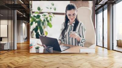 Close-up portrait of nice attractive smart clever cheery focused girl secretary assistant using device creating new plan meeting at modern brick loft industrial interior style workplace workstation Wall mural