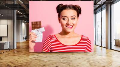 Close-up portrait of nice cute charming attractive winsome glamorous cheerful girl wearing striped t-shirt holding in hands looking favorite dessert life lifestyle advert isolated on pink background Wall mural