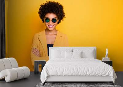 Close-up portrait of nice-looking fashionable attractive pretty content cheerful cheery wavy-haired girl folded arms spring trend isolated over bright vivid shine vibrant yellow color background Wall mural