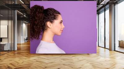 Close-up profile side view portrait of her she nice attractive calm peaceful wavy-haired girl wearing white t-shirt isolated over violet lilac purple pastel color background Wall mural