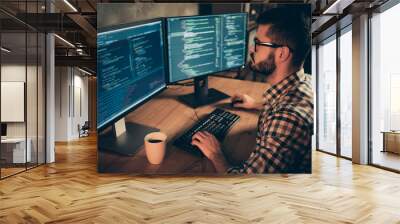 Close up side profile photo handsome he him his guy brainstorming briefing coder typing php css keyboard development outsource IT two monitors table office agency wear specs formalwear plaid shirt Wall mural