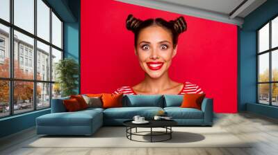 Closeup of happy face young girl with red lips and big brown eyes look at camera on red background Wall mural