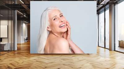 Closeup profile photo of beautiful aged lady applying daily night cream cheek skin procedure isolated grey color background Wall mural