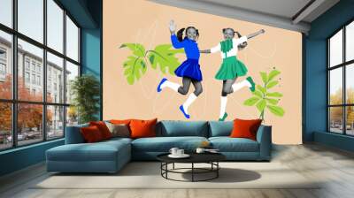 Composite photo collage of two happy school girls jump together classmates education student leaves branch isolated on painted background Wall mural