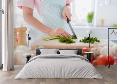 Cropped close-up view of her she hands girl making meal cutting green vitamin weight loss salad on wooden board cutter table desk in modern white light interior style kitchen indoors Wall mural