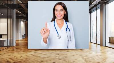 Female doctor in white uniform touching virtual screen Wall mural