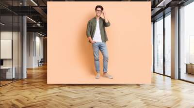 full body length size cadre of young optimistic man wear stylish outfit casual style new eyeglasses  Wall mural