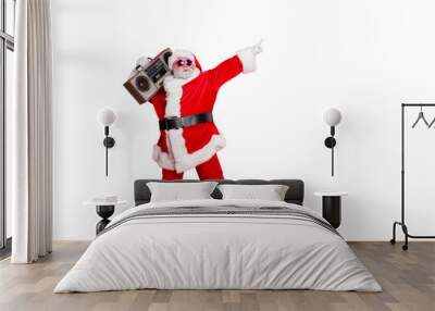 Full body photo of funny cute santa claus with sound boom disco box dancing wearing style eyeglasses eyewear headwear hat isolated over red background Wall mural