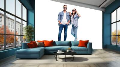 Full body photo of pretty man and woman with eyewear eyeglasses smiling wearing denim jeans jacket isolated over blue background Wall mural