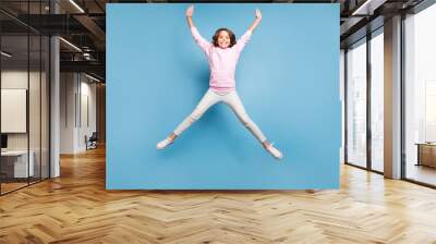 full length body size photo of cheerful positive toothy beaming girl stretching her arms and legs pi Wall mural