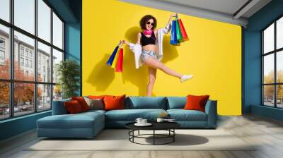 Full length body size photo of funky woman keeping bags in shopping mall laughing isolated bright color background Wall mural