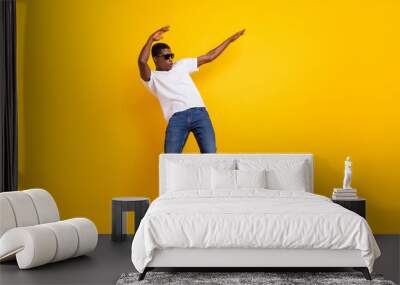 Full length body size view of attractive cheerful guy dancing pout lips having fun isolated over bright yellow color background Wall mural