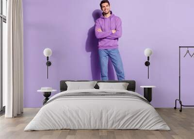 Full length body size view of attractive content cheerful guy folded arms posing isolated over purple violet color background Wall mural