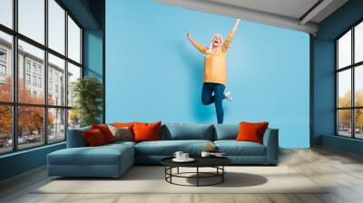 Full length body size view of her she nice attractive lovely cheerful cheery ecstatic dreamy lucky grey-haired woman celebrating having fun isolated on bright vivid shine vibrant blue color background Wall mural