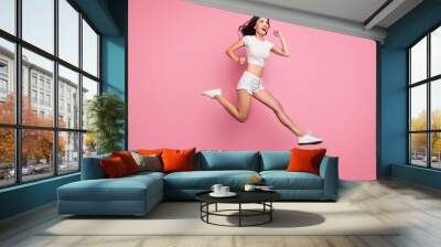 Full length body size view of her she nice attractive lovely dreamy purposeful cheerful cheery wavy-haired girl jumping having fun running fast isolated over pink pastel color background Wall mural