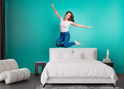 Full length body size view of her she nice-looking attractive lovely winsome cheerful cheery wavy-haired lady having fun like plane wings isolated on bright vivid shine blue background Wall mural