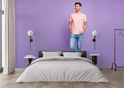 Full length body size view of his he nice attractive fit cheerful glad content guy wearing pink tshirt standing posing enjoying lifestyle isolated on violet purple lilac pastel color background Wall mural