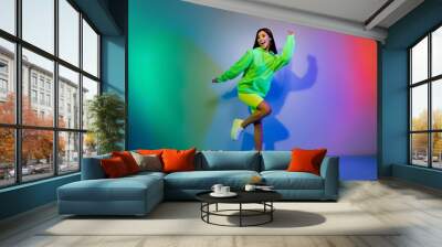 Full length body size view of lovely carefree cheery girl dancing chill out resting night isolated over multicolor vivid neon light background Wall mural