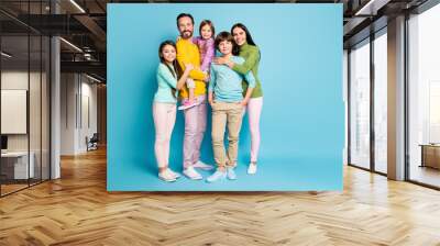 Full length body size view of nice attractive lovely charming pretty perfect tender cheerful family schoolkids offspring embracing isolated on bright vivid shine vibrant blue color background Wall mural