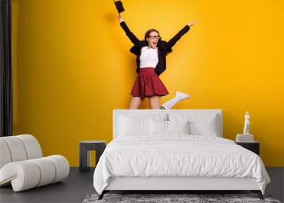 Full length body size view photo of cute lovely lady scream shout delighted hold hand eyewear eyeglasses white crazy sweater black jacket red skirt checked plaid long socks isolated yellow background Wall mural