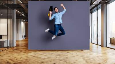 Full length body size view portrait of his he nice-looking attractive cheerful cheery overjoyed ecstatic guy having fun rejoicing winning grant isolated over gray violet purple pastel background Wall mural