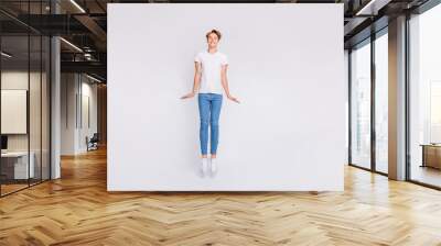 Full length photo of attractive guy jumping high in air wear casual outfit isolated white background Wall mural