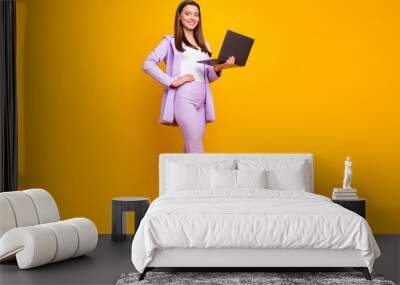 Full length photo of charming business ceo lady holding notebook hands chatting with colleagues partners wear stylish lilac office costume isolated yellow color background Wall mural