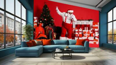 Full length photo of crazy santa claus sing song in mic isolated on red bright color background with x-mas fireplace gift box chair Wall mural