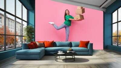 Full length portrait of cheerful crazy person arms hold pile stack packages isolated on pink color background Wall mural