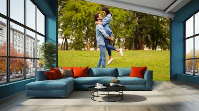 Full length profile photo of overjoyed pair in green park celebrating anniversary wear casual denim outfit Wall mural