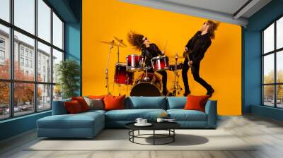 Full size photo crazy two people girlfriend boyfriend enjoy record studio composition ma play bass solo guitar girl drum scream wear leather outfit isolated bright shine color background Wall mural