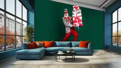 Full size photo of extravagant grandfather christmas gifts decorated outfit isolated on dark green color background Wall mural