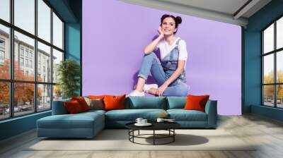 Full size photo of young attractive girl happy positive smile sit floor dream isolated over violet color background Wall mural