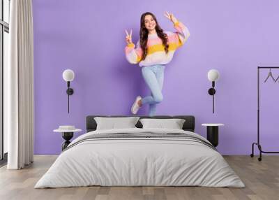 Full size photo of young preteen girl happy positive smile show peace cool v-sign isolated over violet color background Wall mural