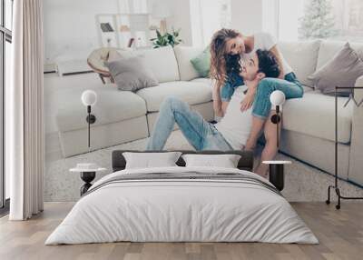 Full size portrait of cheerful positive couple enjoying time together in modern apartments wearing denim clothes. Daydream happiness pleasure home party concept Wall mural