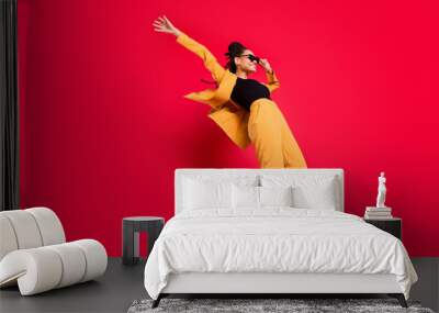 Full size profile photo of funny lady dance wear eyewear yellow suit isolated on vivid red color background Wall mural