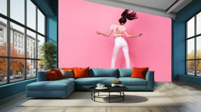 Full size rear photo of carefree positive person dancing flying hairdo isolated on pink color background Wall mural