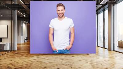 Handsome attractive bearded content guy in white tshirt and jean Wall mural