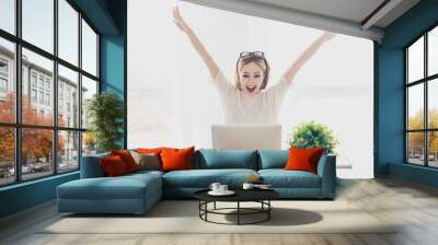 Happy excited successful businesswoman triumphing with laptop Wall mural