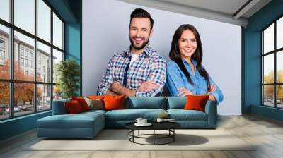 He vs She portrait of caucasian, hispanic couple in shirts - man with bristle and pretty, charming woman with crossed hands standing over grey background Wall mural