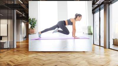 Indoors runner window day light dream improvement wellbeing vitality concept. Full length size photo portrait of sporty sportive sexy sexual lady doing exercise for hips on purple mat Wall mural