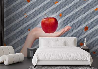 Magazine poster collage of human arm demonstrate sweet fruity red apple on red autumnal painted image background Wall mural