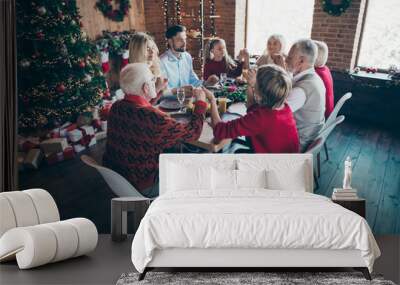 Nice friendly peaceful big full family son enjoying spending December eating homemade lunch holding hands praying in modern industrial loft brick style interior decorated house indoors Wall mural