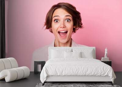 Photo of amazed charming young lady shocked discount news reaction isolated on pastel pink color background Wall mural