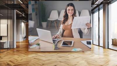 Photo of analyst business woman hold documents read think wear specs jacket workplace office indoors Wall mural