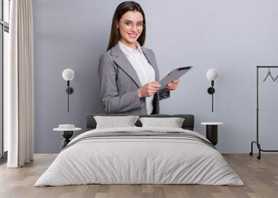 Photo of attractive business lady confident manager worker use modern technology digital tablet work remote distance wear specs shirt plaid blazer isolated grey color background Wall mural