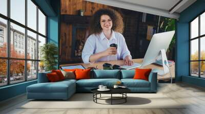 Photo of attractive curly young woman drink coffee break wear formalwear modern office business consultant room interior indoors workspace Wall mural