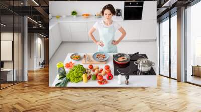 Photo of beautiful housewife lady look unsure boiled shrimps cooking gourmet family dinner prepared ingredients forgot something arms by sides wear apron t-shirt modern kitchen indoors Wall mural