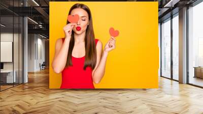 Photo of beautiful lady send air kiss hands little heart shape postcards hide eye romance date invitation wear red swim suit isolated yellow background Wall mural